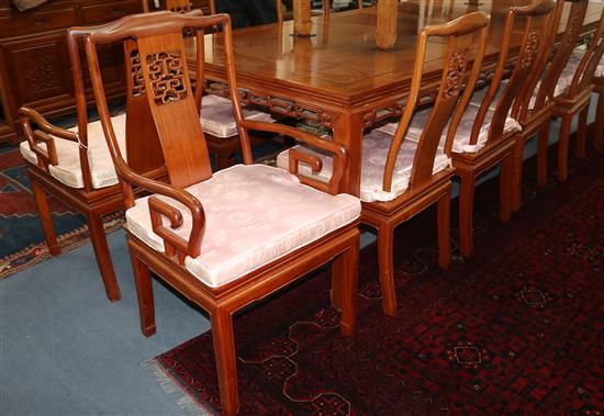 A set of eleven Chinese hardwood dining chairs